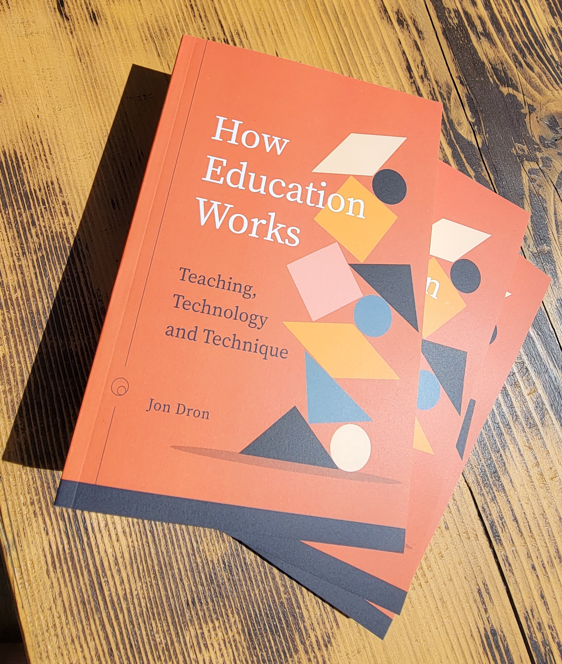 Photo of hard copies of How Education Works